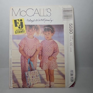 May include: McCall's sewing pattern envelope featuring two young girls in pink dresses. The envelope includes the text "today's spirited family" and "EJ Gitano". The pattern size is CC (2,3,4).