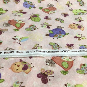 May include: Pink fabric with a repeating pattern of whimsical owls, butterflies, and floral accents in shades of green, orange, purple, and yellow. The fabric includes the text "NIGHTY NIGHT OWL".