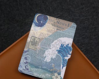 May include: A blue and white e-reader cover with a collage design featuring waves, stars, and a crescent moon. The cover has a vintage newspaper background with text that reads "News-Letter by Authority, Monday, April 28, 1764".