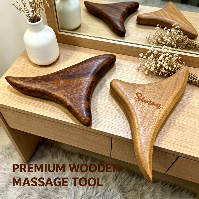 May include: Wooden massage tools in various shades of brown. One tool is engraved with the name "Simon", and another with a deer antler design. The tools are displayed on a wooden surface with the text "PREMIUM WOODEN MASSAGE TOOL".