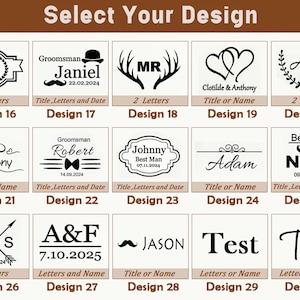 May include: A selection of design options for personalized items. The image displays various text and graphic combinations, including initials, names, dates, and decorative elements like hearts, antlers, and laurel wreaths. The text "Select Your Design" is at the top.
