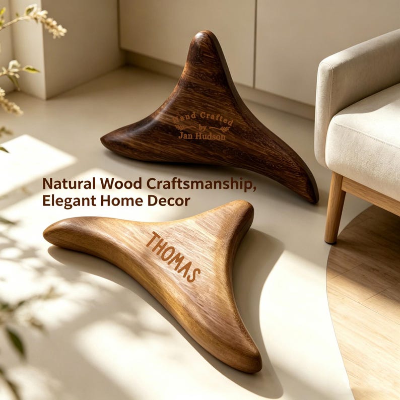 May include: Two wooden, triangular-shaped massage tools. One is a darker brown with the text "Hand Crafted by Jan Hudson". The other is a lighter wood with the name "THOMAS" engraved. The image also includes the text "Natural Wood Craftsmanship, Elegant Home Decor".