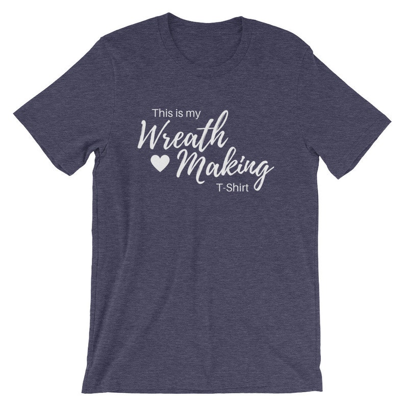 May include: A heather blue t-shirt with the text "This is my Wreath Making T-Shirt" in white lettering with a white heart.