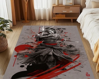 May include: A gray and red rug with a black and white illustration of a person holding two swords. The person is wearing a black and red outfit and is surrounded by red and black paint splatters.
