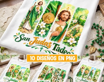 May include: A white t-shirt featuring a watercolor-style graphic of Saint Jude Thaddeus in green robes, a gold medallion, a candle, and white flowers. The text San Judas Tadeo is printed in a decorative font below the religious imagery.