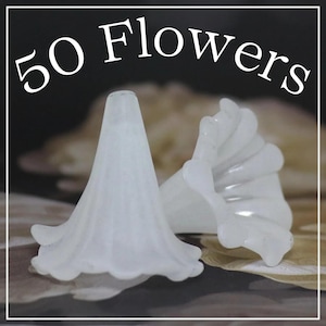 May include: Two white, translucent flower-shaped beads with a ruffled edge. The beads are cone-shaped with a flared, scalloped edge. The image includes the text "50 Flowers" in white, stylized font.