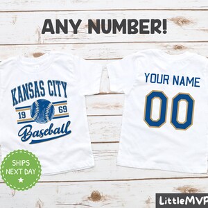 two white shirts with kansas city baseball on them