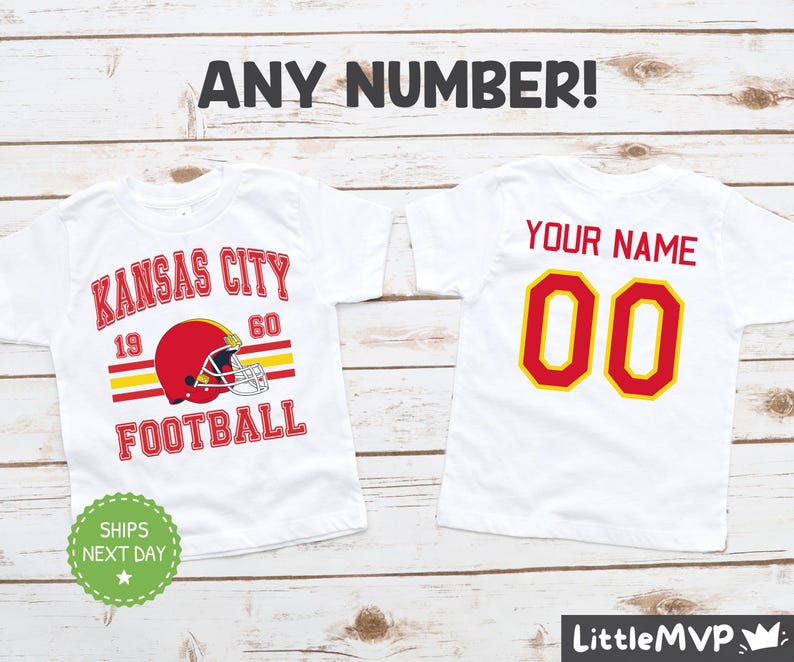 two personalized kansas city football shirts on a wooden background