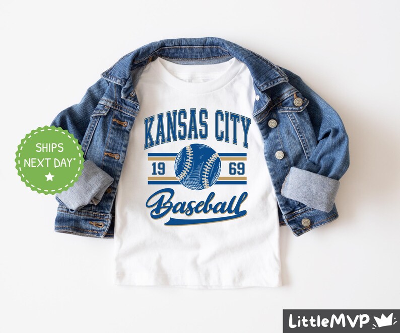 a kansas city baseball t - shirt with a denim jacket