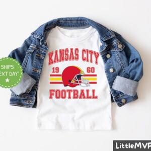 a kansas city football shirt with a jean jacket