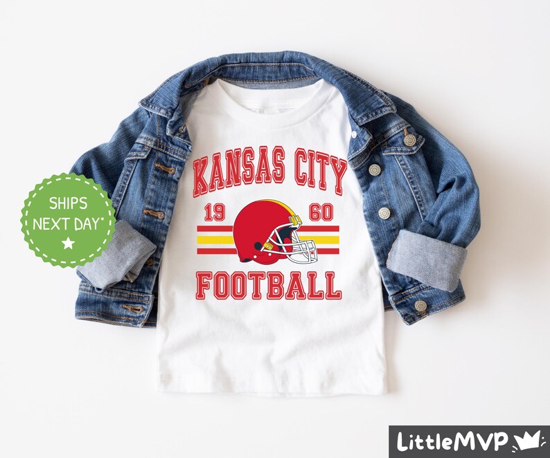 a kansas city football shirt with a jean jacket