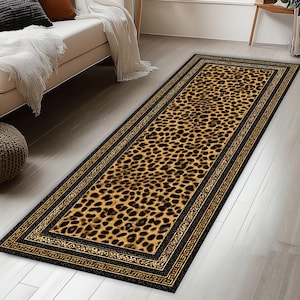 May include: A rectangular leopard print rug with a black border and a gold geometric design. The rug features a repeating pattern of brown and black spots on a tan background. The rug is placed on a light wood floor.