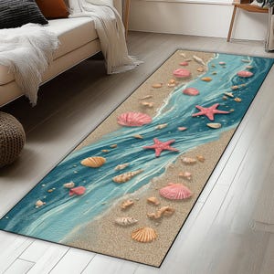 May include: A rectangular rug featuring a beach scene with a blue ocean, sandy shore, and various seashells and starfish. The rug has a coastal theme with pink, beige, and blue colors, suitable for a living room or hallway.