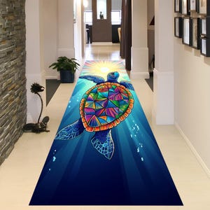 May include: A colorful, abstract, stained glass style sea turtle swimming in a blue ocean with rays of light shining down. The turtle is swimming upwards towards the light.