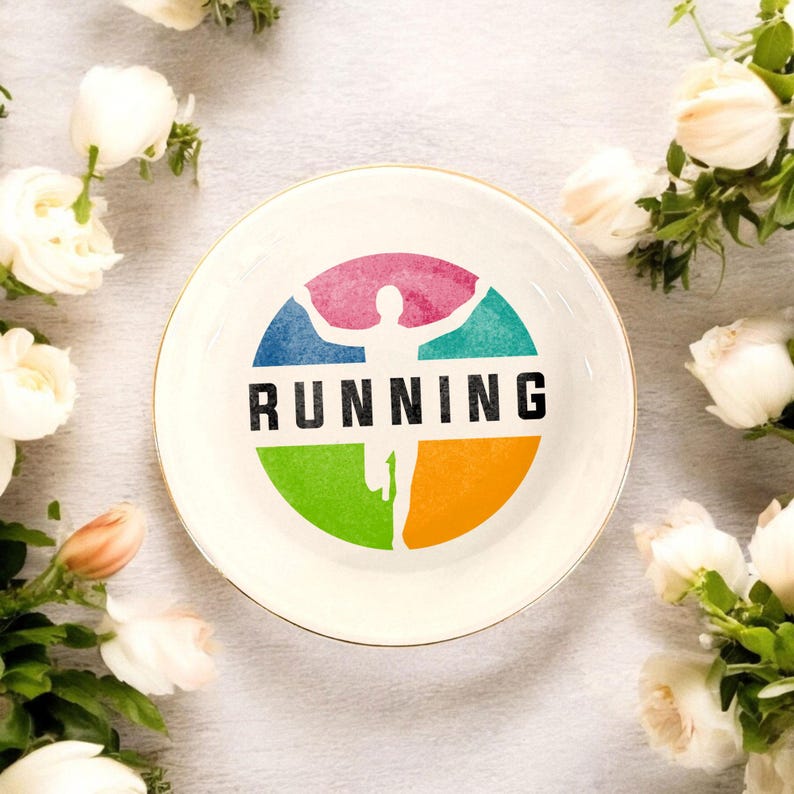 May include: White ceramic dish with a gold rim. The dish features a colorful graphic of a running person with the word "RUNNING" in black text.