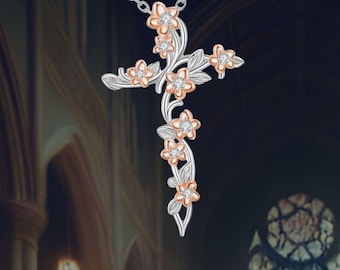 May include: Silver-tone cross pendant necklace with a floral design. The cross features delicate flowers with rose gold petals and sparkling accents. The necklace hangs on a fine silver chain, creating an elegant and symbolic piece of jewelry.