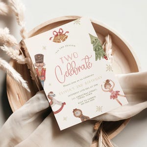 May include: A festive invitation for a second birthday celebration. The card features watercolor illustrations of a nutcracker, a Christmas tree, a ballerina, and a rocking horse. The text reads "Two Celebrate" and includes event details.