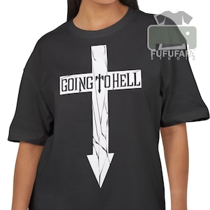 May include: Black t-shirt featuring a white cross design with the words "GOING TO HELL" printed across the top. The cross has a downward-pointing arrow at the bottom. The shirt is a crew neck style.