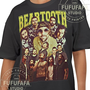 May include: Black t-shirt featuring a group photo of the band Bear Tooth in a vintage style. The band's name is printed in yellow block letters above the image. The shirt has the text "100% Cotton" and "FUFUFAFA STUDIO DTG PRINTED".