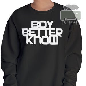 May include: Black sweatshirt featuring the white text "BOY BETTER KNOW". This long-sleeved top is a casual style. The brand logo "FUFUFAF STUDIO" is visible in the upper right corner.
