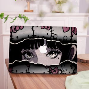 May include: Laptop cover featuring a stylized illustration of a woman's eyes peeking through torn paper. The design incorporates a repeating pattern of Hello Kitty characters in pink and white, with a white Apple logo.
