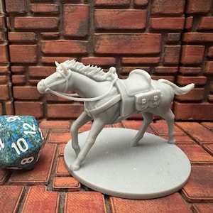 May include: A gray miniature horse figurine with saddle and bridle stands on a round base. A multi-sided die with blue and green patterns is next to the horse. The background is a brick wall.
