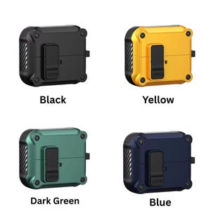 May include: Four protective cases in black, yellow, dark green, and blue. Each case has a rectangular shape with rounded corners, a hinged opening, and the word "OPEN" printed on the front. The cases are designed to protect electronic devices.