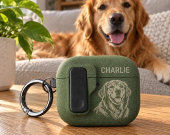 May include: A textured olive green protective case for wireless earbuds featuring a black side latch and a metal ring attachment. The case is engraved with the name CHARLIE and a detailed line art illustration of a golden retriever dog.
