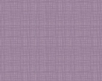 May include: A fabric with a lavender-colored background and a crosshatch pattern in a slightly darker shade of lavender. The fabric has a textured appearance, with a grid-like design. The bottom of the image shows a ruler with inches.