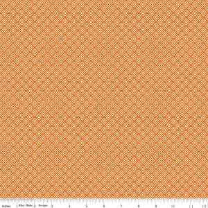May include: Orange fabric with a repeating pattern of small white diamonds. The fabric is textured and has a subtle sheen.