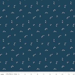 May include: A dark blue fabric with a white repeating pattern of crescent moons and stars. The fabric is 12 inches wide.