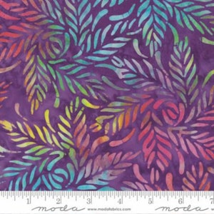 May include: Purple fabric with a colorful leaf pattern. The leaves are in shades of blue, green, yellow, orange, and pink. The fabric is from Moda Fabrics.