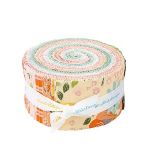May include: A roll of fabric featuring a variety of floral prints in shades of pink, blue, and green. The fabric is rolled up and tied with a white ribbon that reads "Riley Blake Designs" and "Create Colorful."
