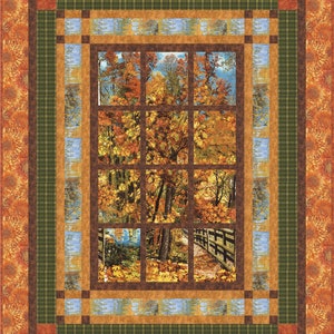May include: A quilt block with a brown, green and blue plaid border. The centre of the block features a window with a view of a forest in autumn. The trees are a mix of orange, yellow and red.