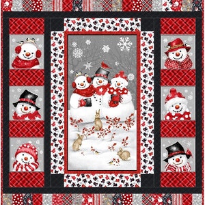 May include: A festive quilt featuring a group of snowmen in a winter scene. The snowmen are wearing hats, scarves, and mittens. The background is a snowy landscape with trees and snowflakes. The quilt is made up of various red, black, and white fabrics.