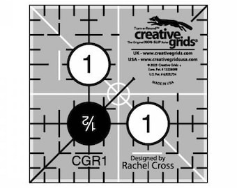 May include: Black and white quilting ruler with a grid pattern and numbers. The ruler is labeled "Creative Grids" and "CGR1". The text "Designed by Rachel Cross" is also included.