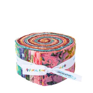 May include: A roll of colorful fabric strips, tightly wound and secured with a white ribbon. The fabric features a variety of floral and abstract patterns in shades of pink, blue, green, and orange. The ribbon has text that reads "Create & Colorfully".