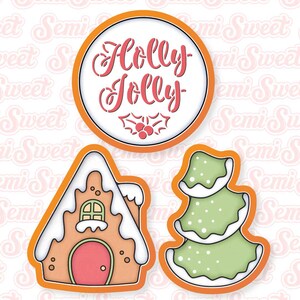 May include: Set of three Christmas-themed cookie cutters. Includes a round cutter with "Holly Jolly" text and holly sprig, a gingerbread house, and a Christmas tree, all with orange outlines.