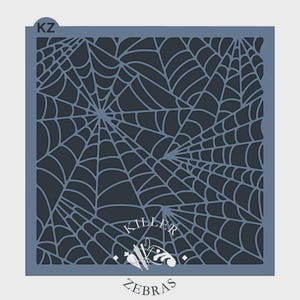 May include: A square stencil featuring a detailed spiderweb design. The web is rendered in a dark gray color against a lighter gray background. The stencil includes the text "KILLER ZEBRAS".