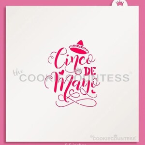 May include: A pink stencil with the words "Cinco de Mayo" in a decorative font, topped with a sombrero. The stencil measures 5.5 inches across. The Cookie Countess logo is visible.
