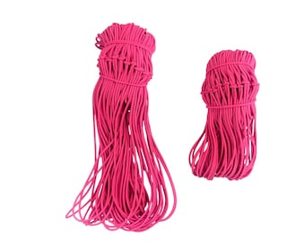 May include: Two bundles of bright pink elastic cord, one large and one small, against a white background. The cords are tightly bound at the top, with long, loose strands extending downwards. The elastic appears to be new.