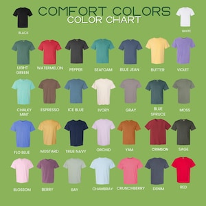 May include: A color chart of Comfort Colors t-shirts in various shades, including black, white, and red. The chart displays a range of colors, such as light green, violet, and blue jean. The text "COMFORT COLORS COLOR CHART" is at the top.