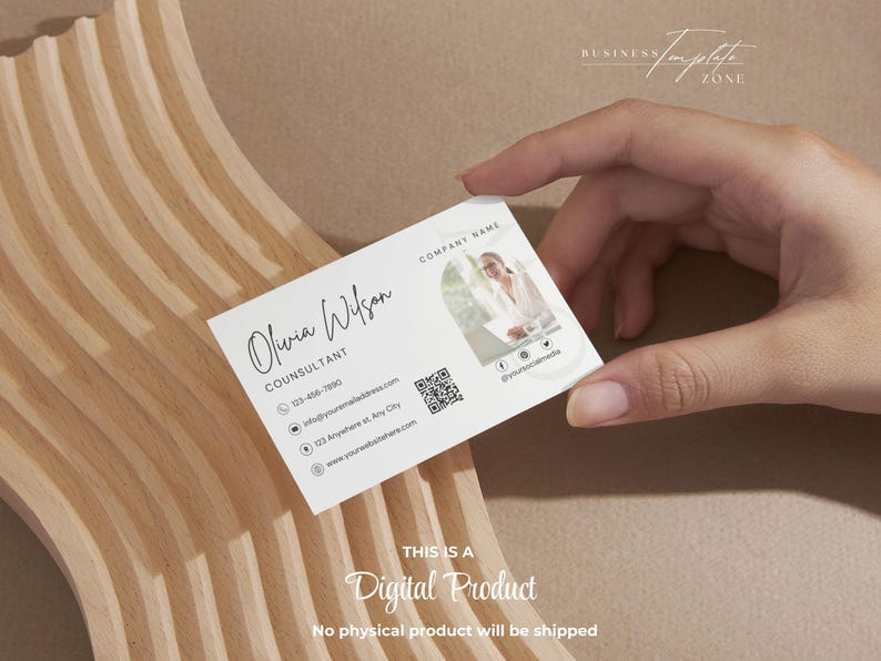 May include: White business card with a minimalist design featuring the name Olivia Wilson, the title Consultant, a phone number, email address, website address, and a QR code. The card also includes a circular photo of a woman in a professional setting.