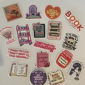 May include: A collection of colorful stickers with book-themed designs. The stickers feature phrases like "Hot Girls Read Books," "Enemies to Lovers," and "One More Chapter." Other designs include stacks of books, a tombstone, and a skull.