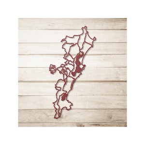 May include: A red wooden map of a region, likely a state or county, with detailed outlines of its subdivisions. The map is mounted on a light-colored, wood-paneled background, creating a rustic aesthetic. The map's design highlights geographical features.