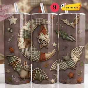 May include: Three cylindrical tumblers with clear straws featuring a brown plaid background, patchwork-style crescent moons, and bats with patterned wings. The design includes small stars, autumn leaves, and the text "SPOOKY SEASON" on the moon.