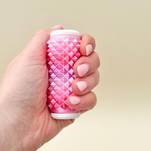 Pink gradient spiky roller, firm sensory tool for neurodivergent adults and teens.