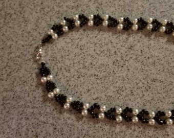 White and dark brown necklace approximately 20".