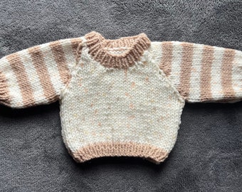 Hand knitted jumper for a doll or bear