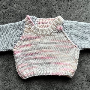 Hand knitted jumper for a doll or bear